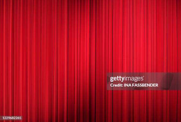 Picture taken on November 19, 2020 shows the closed red curtain at the Lichtburg cinema in Essen, western Germany. - The Lichtburg, which was built...