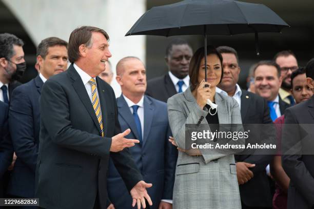 Jair Bolsonaro, President of Brazil, and first lady Michelle Bolsonaro, during Commemorates Brazilian Flag Day amidst the coronavirus pandemic at the...