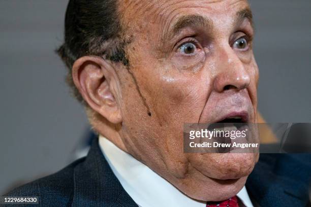 Rudy Giuliani speaks to the press about various lawsuits related to the 2020 election, inside the Republican National Committee headquarters on...