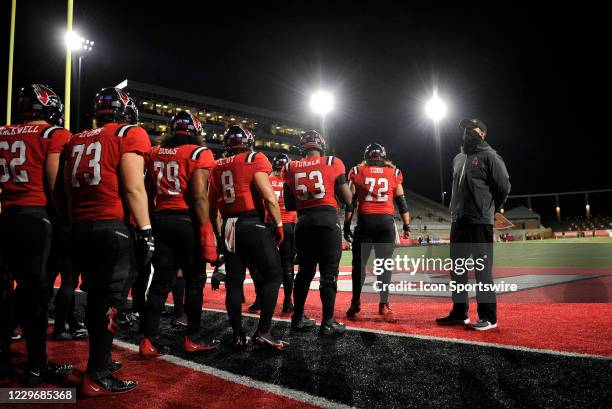 Ball State Cardinals head coach Mike Neu prepares to lead his team on to the field for the start of the Mid American Conference college football game...