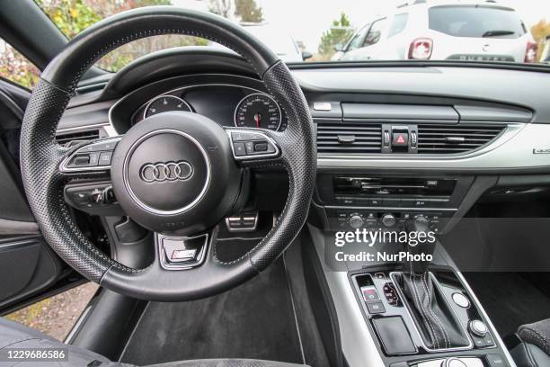 Audi A6 S-line Quattro interior with steering wheel and gearbox shifter is seen in Gdynia, Poland on 19 November 2020