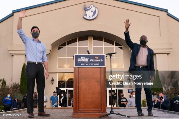 Democratic U.S. Senate candidates Raphael Warnock and Jon Ossoff are seen at a campaign event on November 19, 2020 in Jonesboro, Georgia. Democratic...