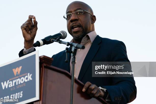 Democratic U.S. Senate candidate Raphael Warnock speaks at a campaign event on November 19, 2020 in Jonesboro, Georgia. Democratic U.S. Senate...