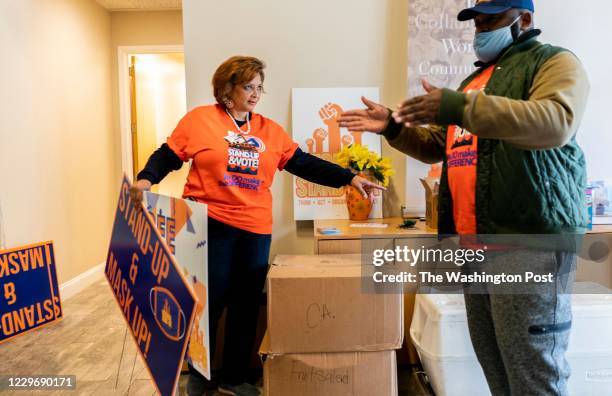 On Election Day Deborah Scott, Executive Director of Georgia Stand-UP and a member of Black Women's Roundtable, works with her staff to continuously...