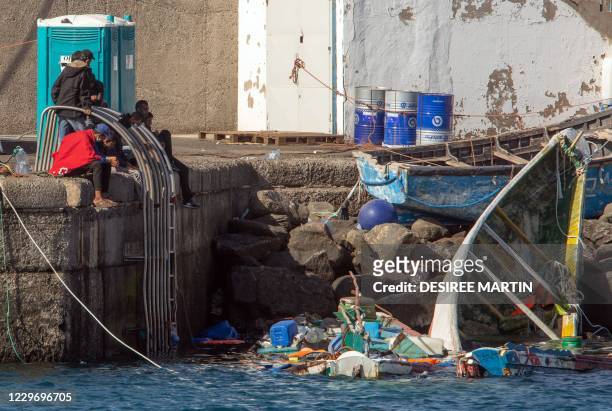 Migrants from a group of 1334 rescued from different boats remain in the port of Arguineguin while being cared for by the Spanish Red Cross and the...
