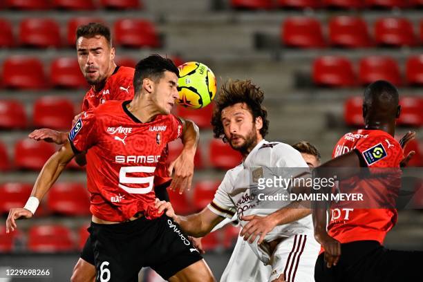 Bordeaux's French defender Paul Baysse fights for the ball with Rennes' French defender Damien Da Silva , Rennes' Moroccan defender Nayef Aguerd...