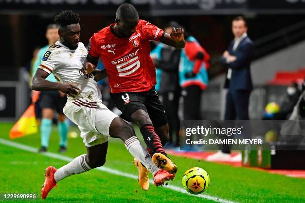 Rennes' French forward Serhou Guirassy fights for the ball with Bordeauxs Midfielder Enock Bordeaux's French defender Enock Kwateng during the French...