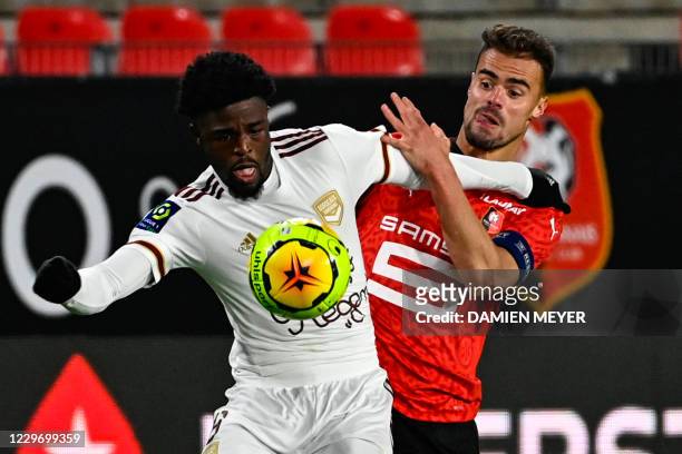 Bordeaux's English forward Josh Maja fights for the ball with Rennes' French defender Damien Da Silva during the French L1 football match between...