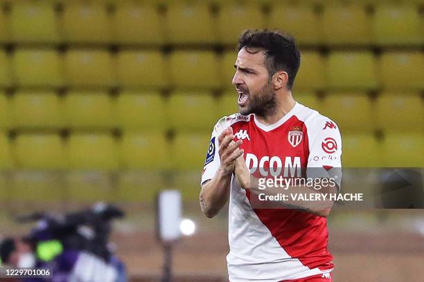 Monaco's Spanish midfielder Cesc Fabregas celebrates after scoring a penalty kick during the French L1 football match between Monaco and Paris...