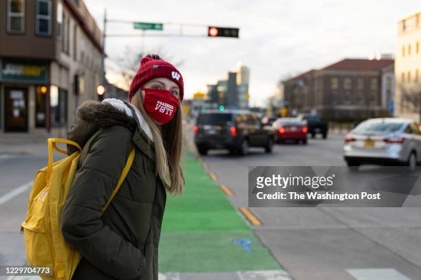 Hannah Bounds of Racine, Wis., walks back to her dorm room after an in-person class Nov. 17, 2020. Bounds is a junior and a house fellow in a...
