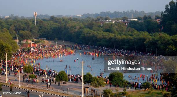 An aerial view showing a large crowd of devotees performing Chhath Puja rituals at Sector 42 Lake, on November 20, 2020 in Chandigarh, India.