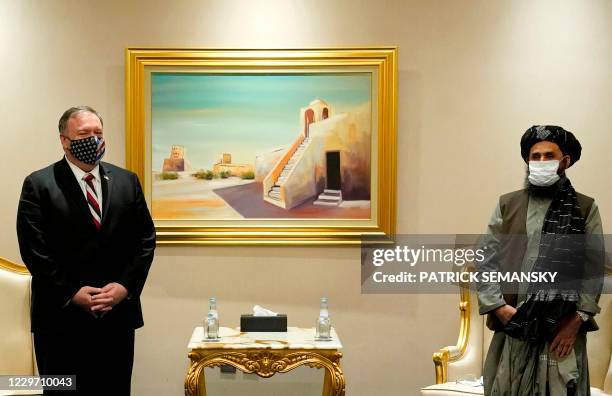 Secretary of State Mike Pompeo meets with Taliban co-founder Mullah Abdul Ghani Baradar in the Qatari capital Doha, on November 21, 2020. - US...