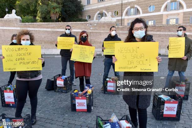 Movements, associations, civic networks and individual citizens demonstrate in Piazza del Popolo and collect food for families in distress in an...