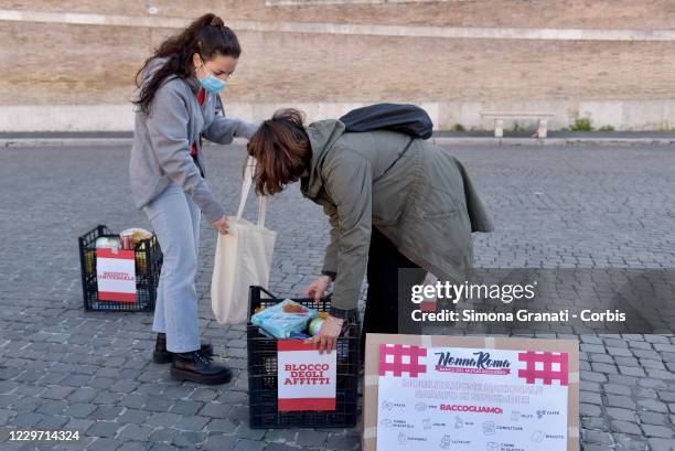 Movements, associations, civic networks and individual citizens demonstrate in Piazza del Popolo and collect food for families in distress in an...