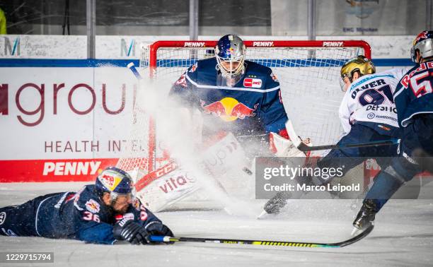 Yannic Seidenberg, Kevin Reich of EHC Red Bull Muenchen and Mark Olver of the Eisbaeren Berlin during the Magenta Sport Cup match between EHC Red...