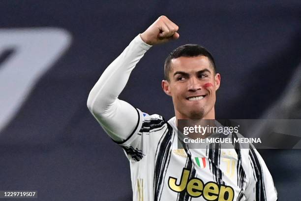 Juventus' Portuguese forward Cristiano Ronaldo celebrates after opening the scoring during the Italian Serie A football match Juventus vs Cagliari on...