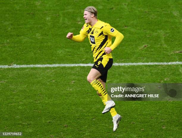 Dortmund's Norwegian forward Erling Braut Haaland celebrates scoring their third goal and his hattrick during the German first division Bundesliga...