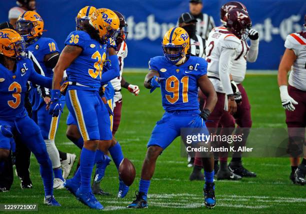 Patrick Jones II of the Pittsburgh Panthers celebrates after recovering a fumble against Tre Turner of the Virginia Tech Hokies at Heinz Field on...