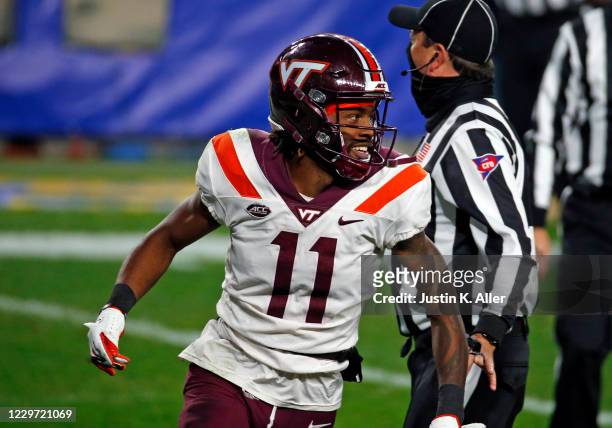 Tre Turner of the Virginia Tech Hokies celebrates a 55 yard touchdown pass in the second quarter against the Pittsburgh Panthers at Heinz Field on...