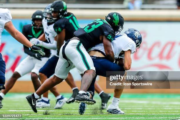 North Texas Mean Green linebacker KD Davis sacks Rice Owls quarterback Mike Collins during the game between the North Texas Mean Green and the Rice...