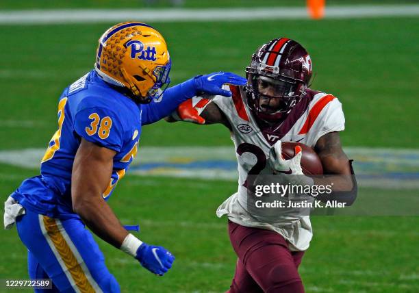 Jalen Holston of the Virginia Tech Hokies rushes against Cam Bright of the Pittsburgh Panthers at Heinz Field on November 21, 2020 in Pittsburgh,...