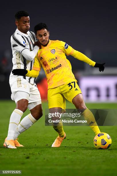 Adam Ounas of Cagliari Calcio is challenged by Danilo Luiz da Silva of Juventus FC during the Serie A football match between Juventus FC and Cagliari...