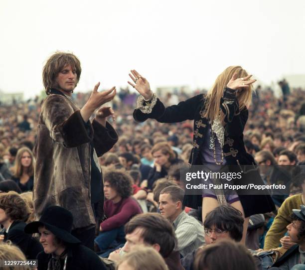 People dancing in the crowd during the second Isle of Wight Festival, held in the village of Wootton on the Isle of Wight in England on 30 August,...