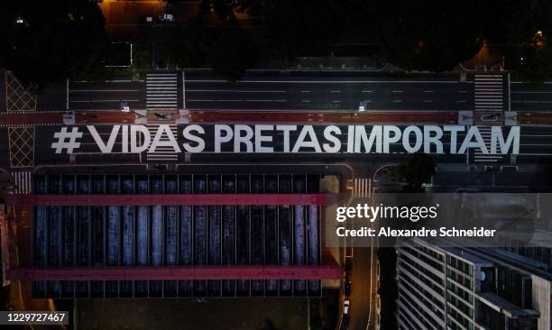 An aerial view of Paulista Avenue painted with the words #Vidas Pretas Importam as protests erupt against racism on November 22, 2020 in Sao Paulo,...