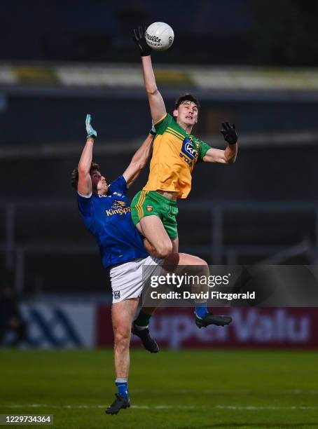 Armagh , United Kingdom - 22 November 2020; Michael Langan of Donegal in action against Oisin Kernan of Cavan during the Ulster GAA Football Senior...