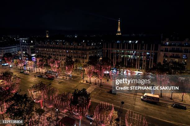 Picture shows a general view of the Champs-Elysees Avenue and the Eiffel Tower in the background during the inauguration of the Christmas season...