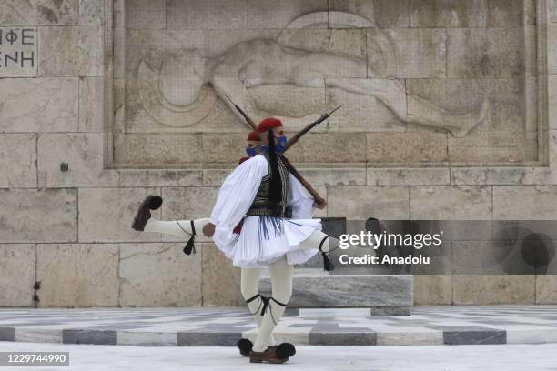 Greek Presidential guards on duty wearing protective face mask on the Monument of the Unknown Soldier in Athens, Greece on November 22, 2020. Greece...