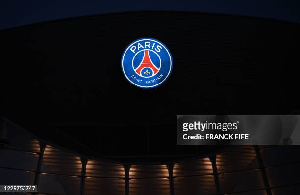Photograph taken on November 23, 2020 shows a logo of Paris Saint-Germain at the Parc des Princes stadium in Paris, on the eve of the UEFA Champions...