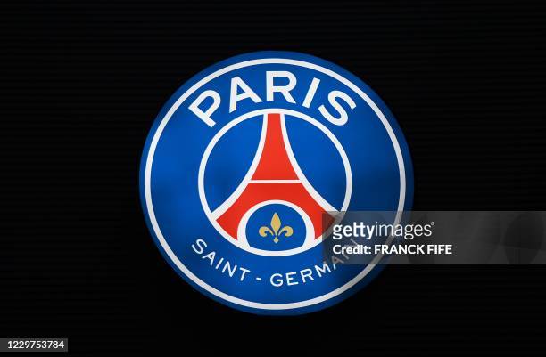 Photograph taken on November 23, 2020 shows a logo of Paris Saint-Germain at the Parc des Princes stadium in Paris, on the eve of the UEFA Champions...