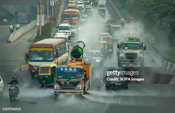 Anti smog gun vehicle sprays water on the road to reduce air pollution. The increasing pollution in India has become alarming. An "anti- smog gun" is...