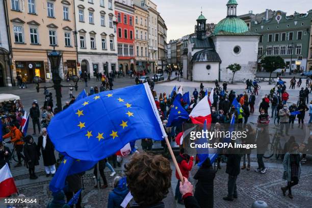 Protester holding a European Union flag during the demonstration. People protest against the ruling Law and Justice party right wing government which...