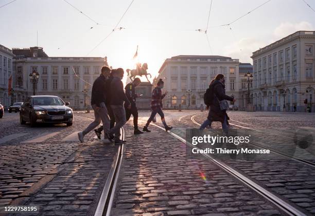 People walk past the 'Rue Royale' on November 23, 2020 in Brussels, Belgium. The country had earlier moved into a second national lockdown in an...