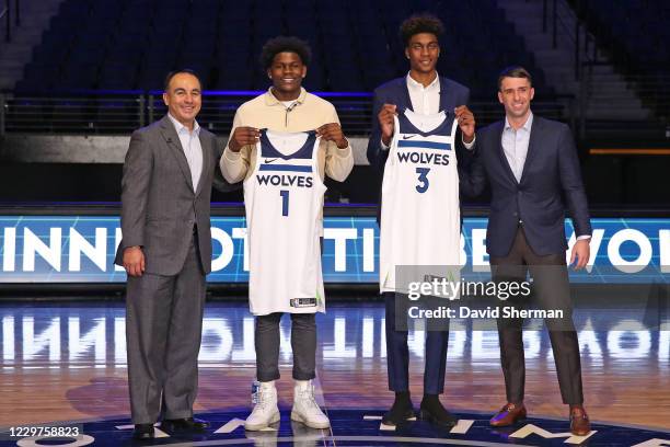 President of Basketball Operations Gersson Rosas and Head Coach Ryan Saunders pose for a photo with Jaden McDaniels and Anthony Edwards, draft picks...