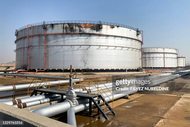 This picture taken on November 24, 2020 shows a view of a damaged silo at the Saudi Aramco oil facility in Saudi Arabia's Red Sea city of Jeddah. -...