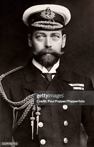Vintage postcard featuring King George V in his Royal Navy uniform, published in London, circa 1911.