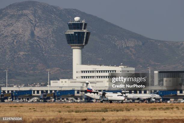 Sky Express ATR 42 aircraft as seen take off in front of the Terminal and Control Tower of the airport and fly from Athens International Airport ATH...