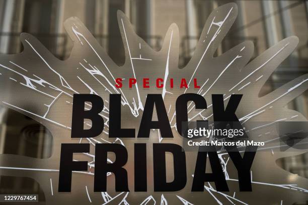 Sign that announces a price discount for Black Friday on the display window of a shop in downtown Madrid. According to the iAhorro purchasing...