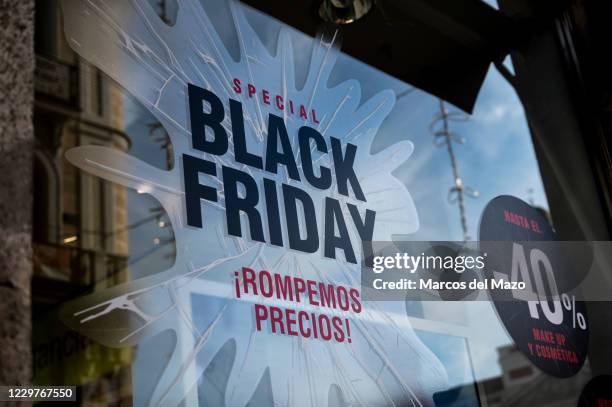 Sign that announces a price discount for Black Friday on the display window of a shop in downtown Madrid. According to the iAhorro purchasing...