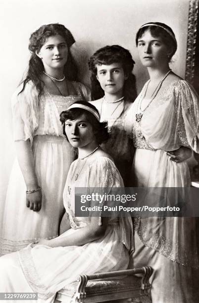 Vintage postcard featuring the four daughetrs of Tsar Nicholas II and Tsarina Alexandra of Russia, left to right, The Grand Duchesses Maria, Tatiana,...