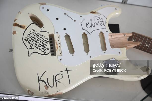 Fender Stratocaster guitar stage played and smashed by music legend Kurt Cobain is displayed at a press preview of Julien's Auctions Presents Icons...