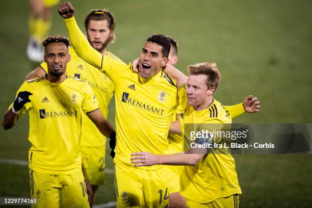 Daniel Rios of Nashville SC celebrates the game winning goal with Captain Dax McCarty of Nashville SC in the second period of overtime during the...