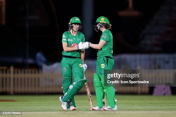 Annabel Sutherland of the Melbourne Stars and Nat Sciver of the Melbourne Stars fist pump each other during the Women's Big Bash League semi final...