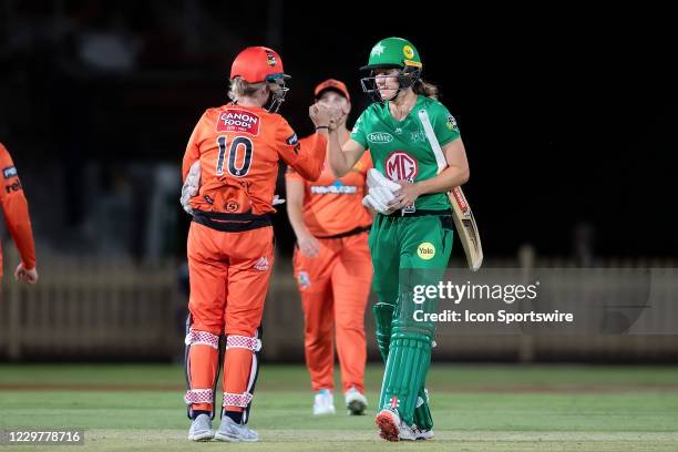 Annabel Sutherland of the Melbourne Stars fist pumps Beth Mooney of the Perth Scorchers after winning the match during the Women's Big Bash League...