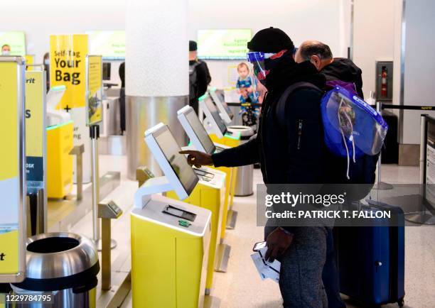 Passenger checks in for a Spirit Airlines flight at Los Angeles International Airport ahead of the Thanksgiving holiday in Los Angeles, California,...