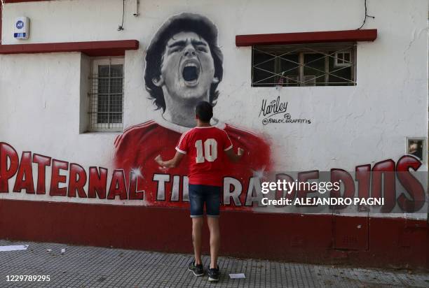 Fans of Argentinian football legend Diego Maradona gather outside Argentinos Junior's Diego Armando Maradona Stadium in La Paternal neighbourhood,...