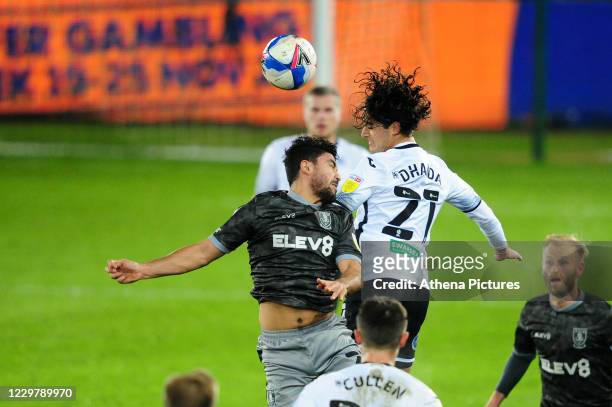 Massimo Luongo of Sheffield Wednesday vies for possession with Yan Dhanda of Swansea City during the Sky Bet Championship match between Swansea City...